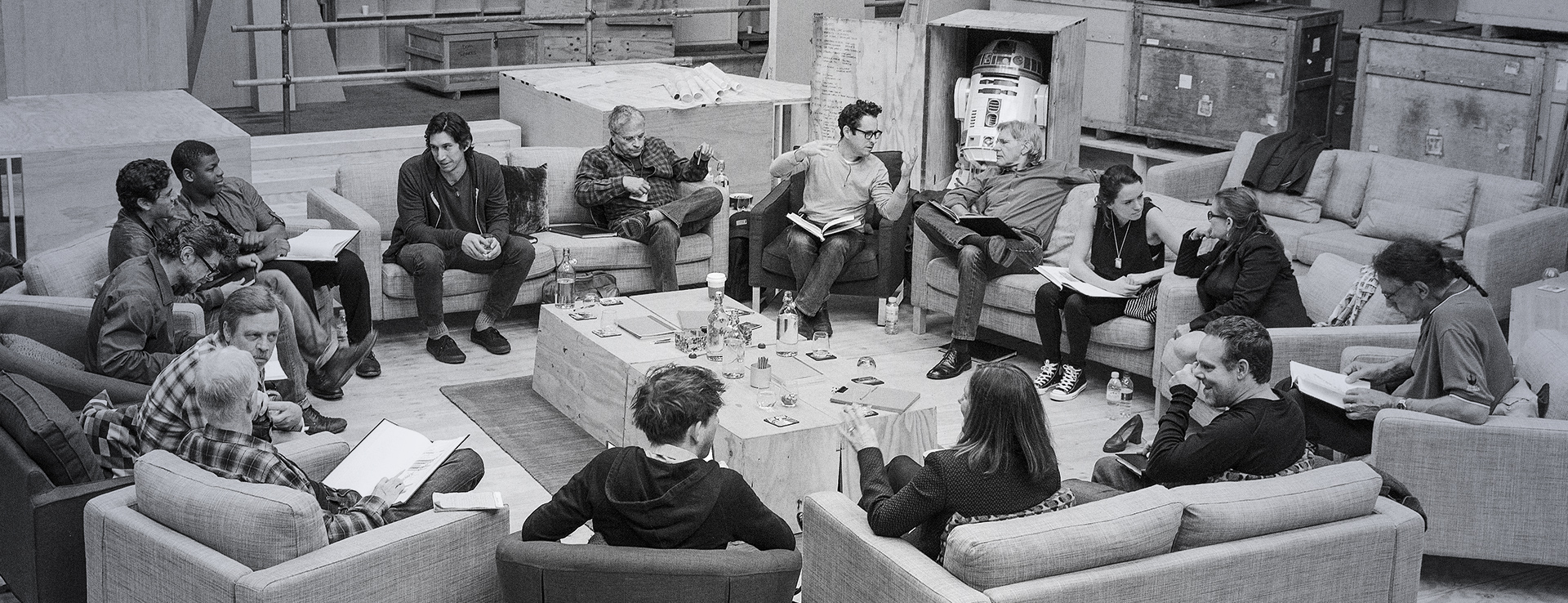 Cast members from Star Wars: The Force Awakens sitting in a circle for a reading of the script