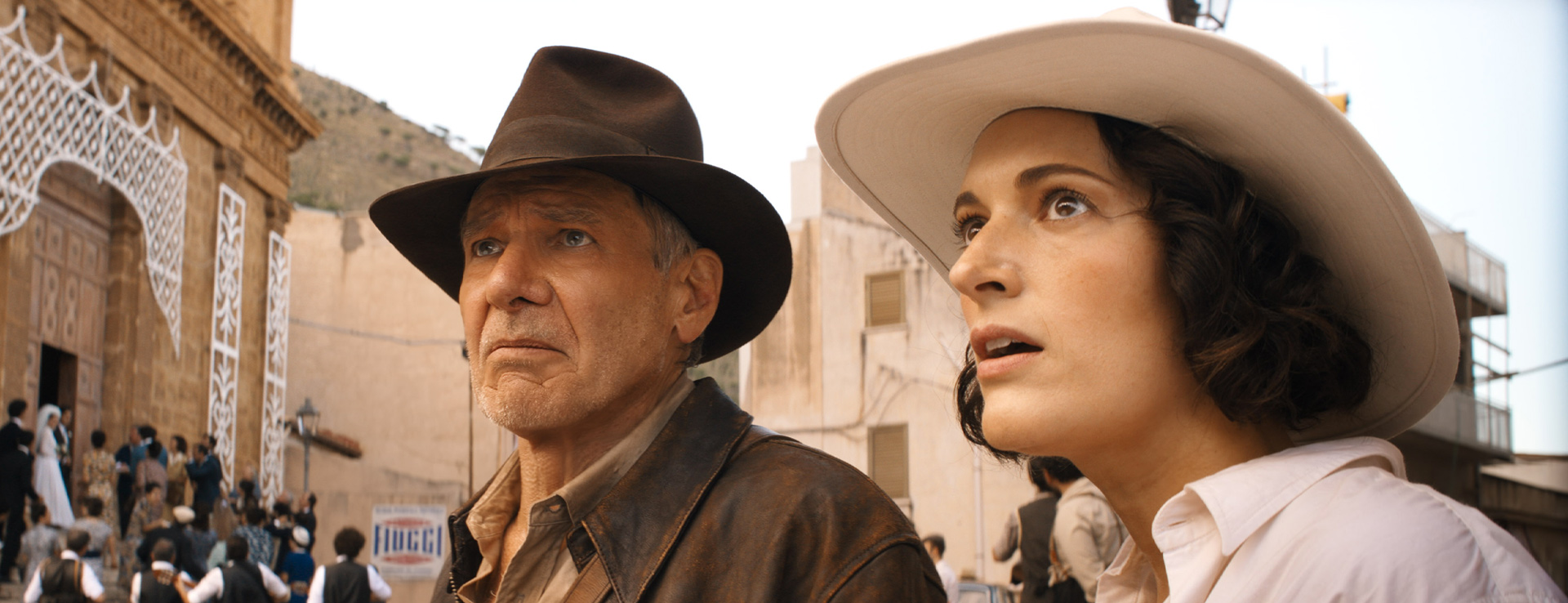 (L-R): Indiana Jones (Harrison Ford) and Helena (Phoebe Waller-Bridge) in Lucasfilm's INDIANA JONES AND THE DIAL OF DESTINY. ©2023 Lucasfilm Ltd.