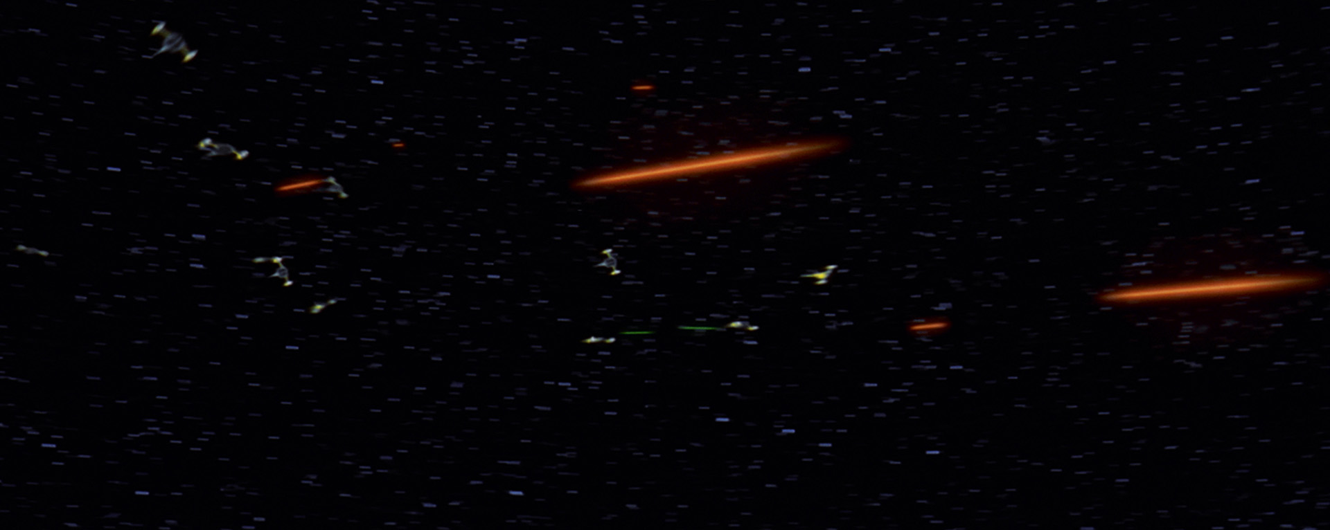 Naboo starfighters and Trade Federation starfighters dogfight in space in Star Wars: The Phantom Menace.